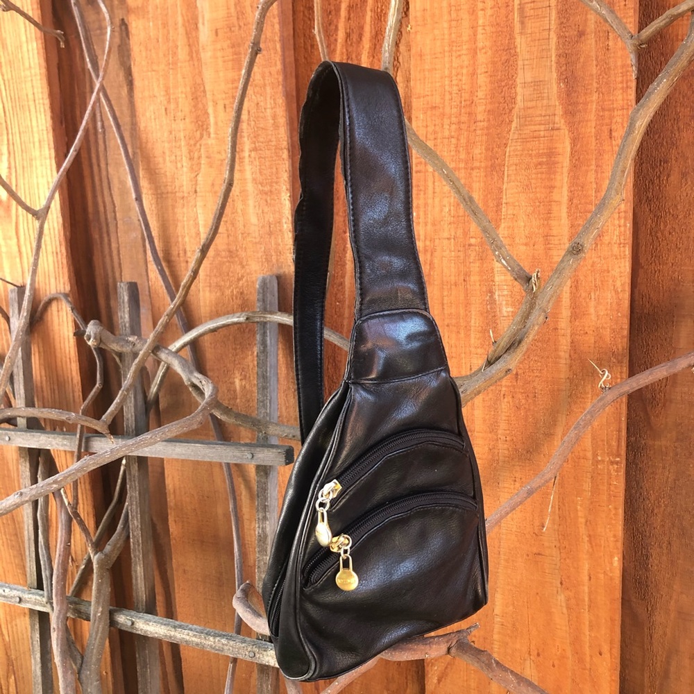 Black sling shoulder backpack bag with gold detail